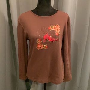 From MC SPORTSWEAR, this elegant chocolate top features suede cardinals.